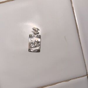 CHANEL Silver and Cream Perfume Bottle pendant